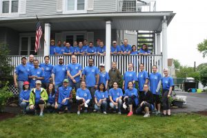 Volunteers at a Domus property for painting, construction, and gardening