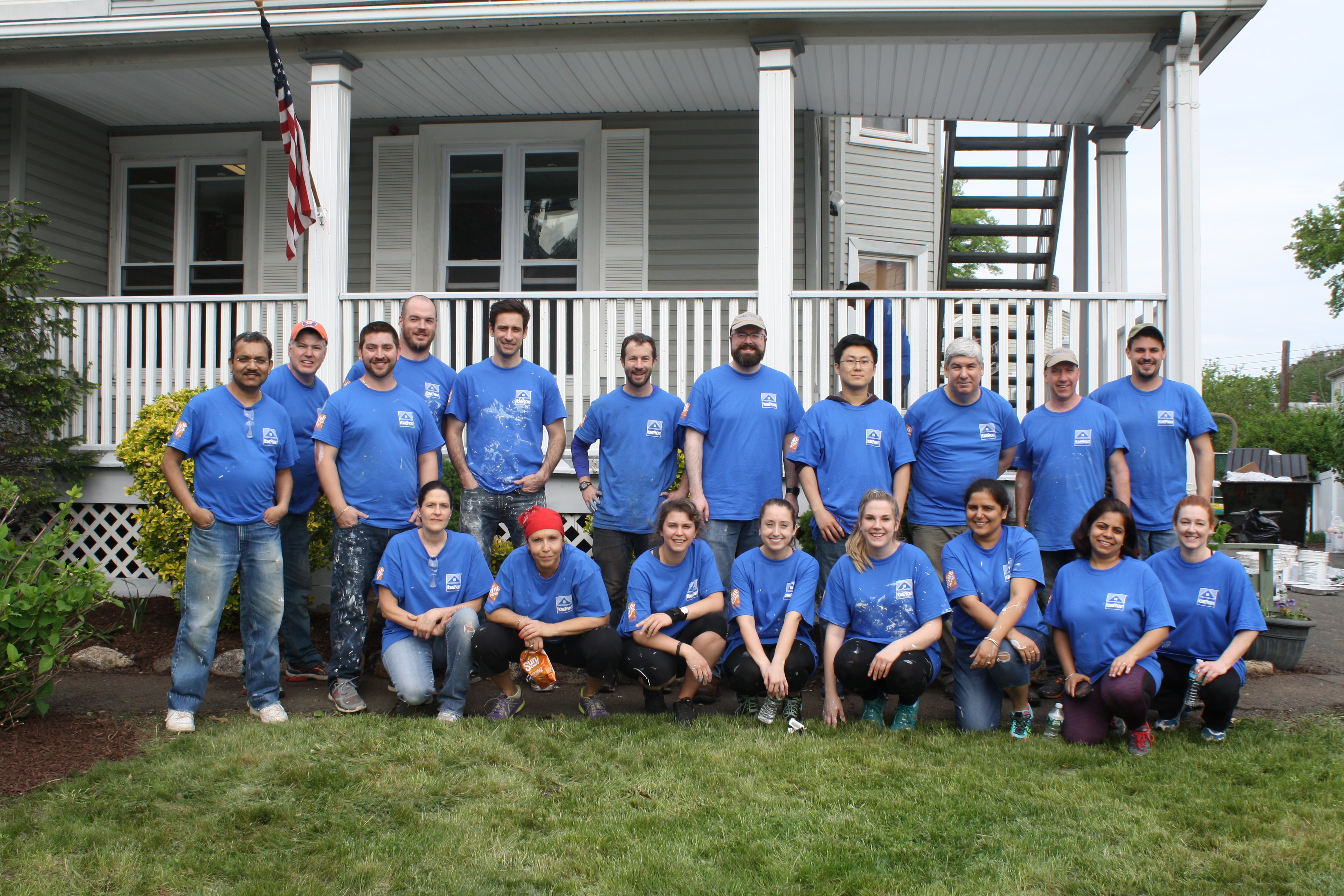 Volunteers at a Domus property for painting, construction, and gardening
